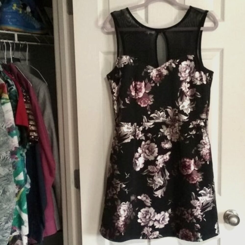 Sleeveless black floral dress with pockets